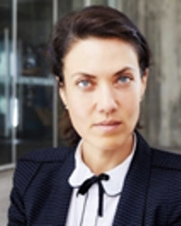 Professor Natalia Szablewska, with short dark hair, wearing a white blouse and a dark coloured jacket