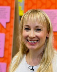 Professor Victoria Newton, with long, blonde hair, smiling at the camera