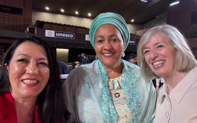 Dr Alexandra Okada with two other ladies smiling at the camera