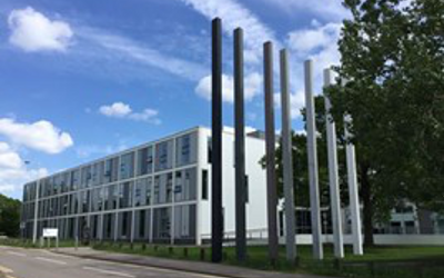 The Betty Boothroyd Library, a rectangular, white, three-storey building, with a glass frontage