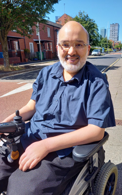 Hamied Haroon, sitting in a wheelchair