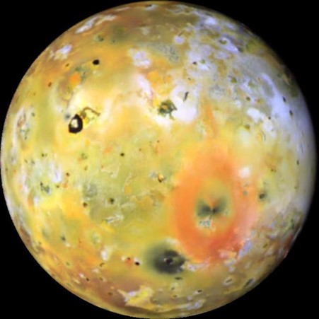 Jupiter's moon, Io, with a mottled yellow, red, white and black surface