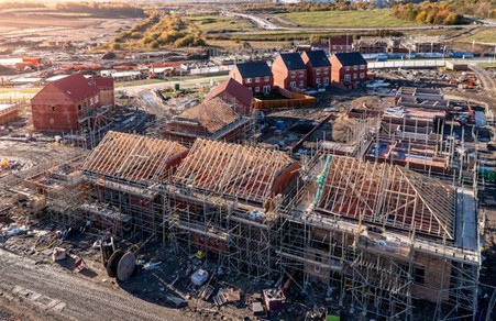 A new housing estate, with several houses in the process of being constructed