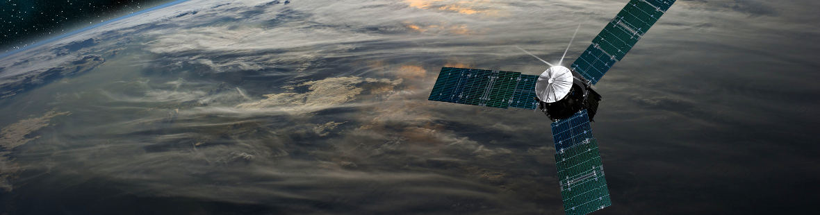 A space probe over a cloud-covered planet, with stars in the background