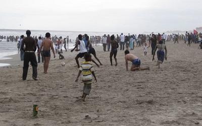 Photo of Chinese and Ghanaians playing football on a beach near Ghana’s capital, Accra