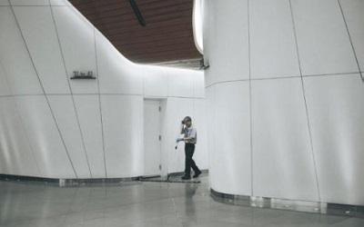 Photo of a male cleaning in an empty building