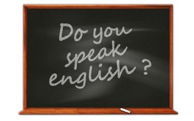 Blackboard with the words 'do you speak english?' written on it