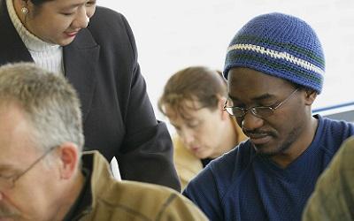 Male learner studying in a group environment