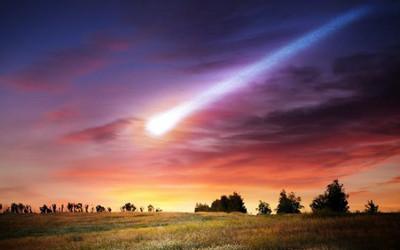 Fields, trees and asteroid in the sky. Triff/Shutterstock