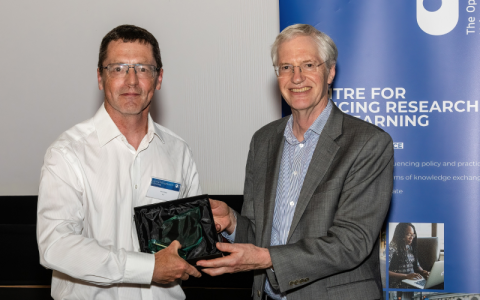 Paul Walley accepting his award from Tim Blackman, Vice-Chancellor of The Open University.