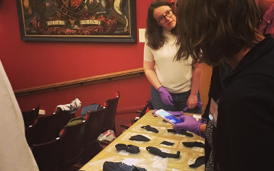 Group of people looking at artefacts
