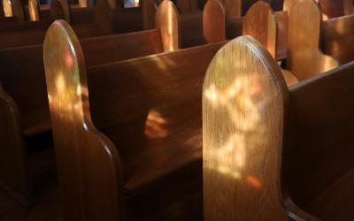 Rows of wooden church pews