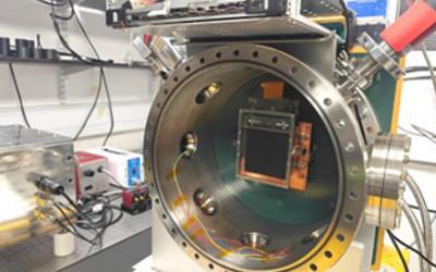 A CMOS detector - a large round, metal instrument