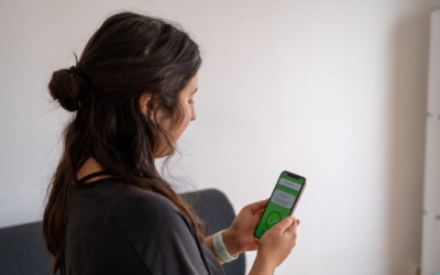 Person using OU COVID-19 digital immunity passport on mobile phone