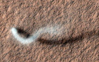 View of brown ground from above, with a white, wavy line across it