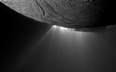 Rays of light shining off the surface of a planet