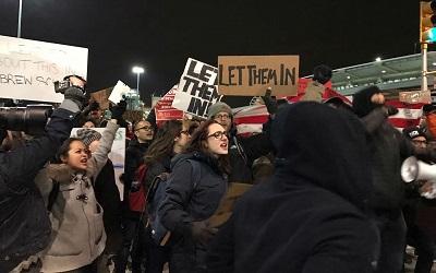 Group of protestors fighting for refugees to be allowed in