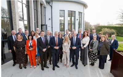Mark Durkin standing with a group of people outside a building