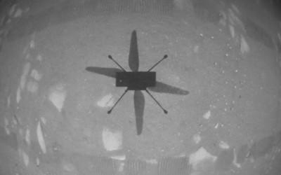 NASA’s Ingenuity Mars Helicopter hovers over the Martian surface. NASA
