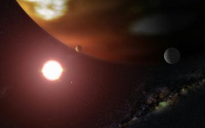 Planets and a bright star against a dark background