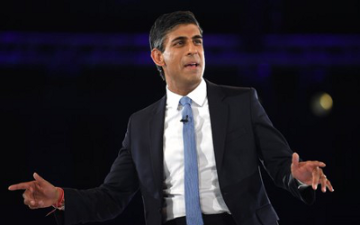 Man in a suit with a white shirt and a blue tie