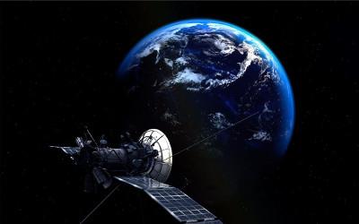 A satellite in Space, with the Earth in the background