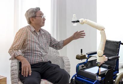 Robot helping elderly person