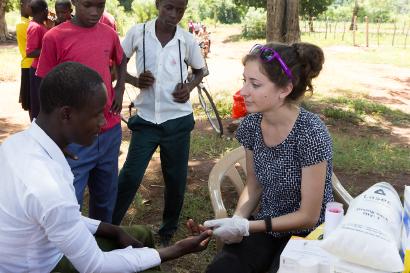 Woman testing an African man for HIV