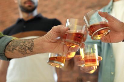 Friends toasting with whisky