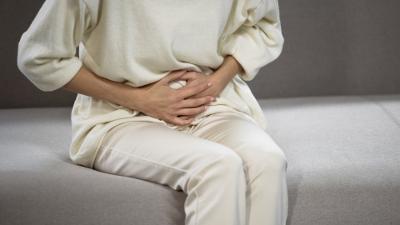 Lady suffering from stomach pain