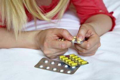 Woman taking pills