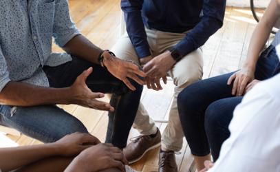 Group of black people sitting in a circle