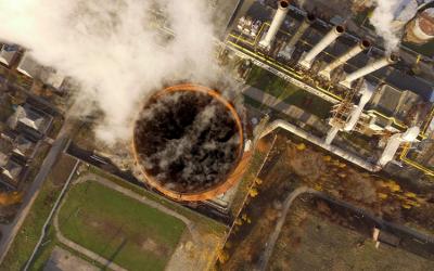 Arial view of smoke emissions from an industrial pipe