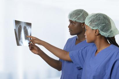Shutterstock-169502801 African doctors looking at xray of lungs