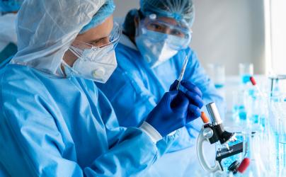 Coronavirus researchers in PPE in a lab