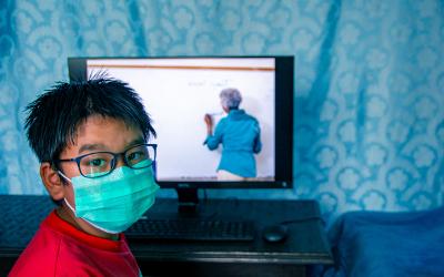 Nepalise child with computer learning online