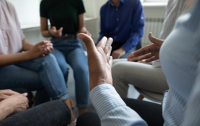 Group of people sitting in a circle