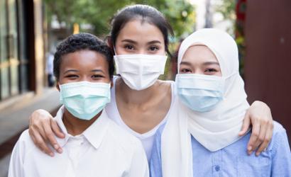 Diverse group of young people wearing facemasks