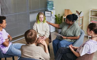 Group of students sitting with a psychologist