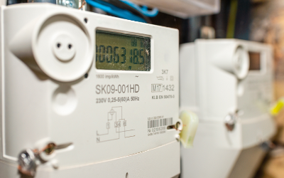 A white smart meter with digital numbers on it