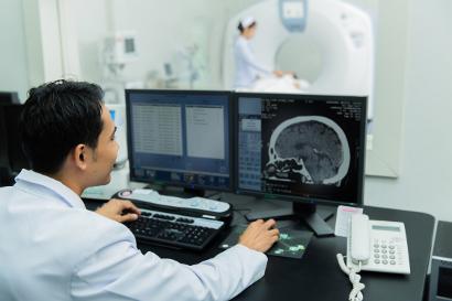 Man checking a brain scan
