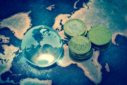 Shutterstock-509169151 Crystal globe with money on map