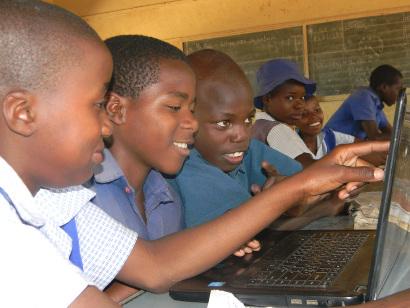 African school boys using a laptop
