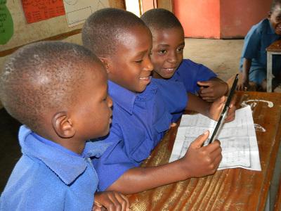African school children using a tablet