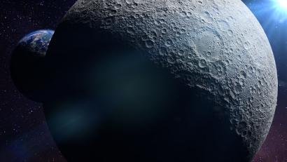 Planet earth behind the far side of the moon