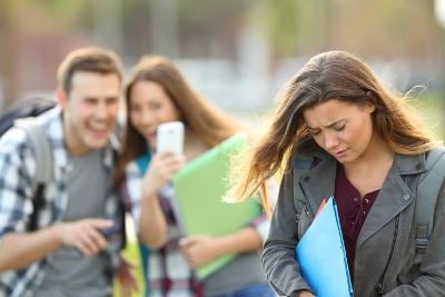 Bullying vicitim being video recorded on smartphone