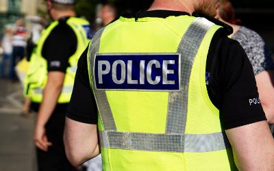 Two policemen wearing high-viz jackets