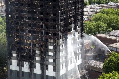 Shutterstock-667008772 Hoses dousing the fire at Grenfell Tower