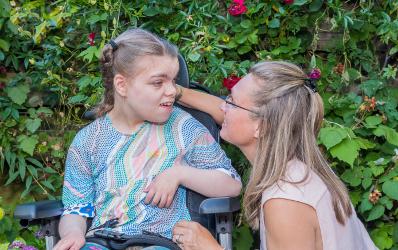 Disabled young girl with carer