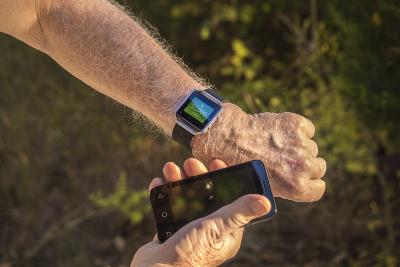 Man with smart device and phone